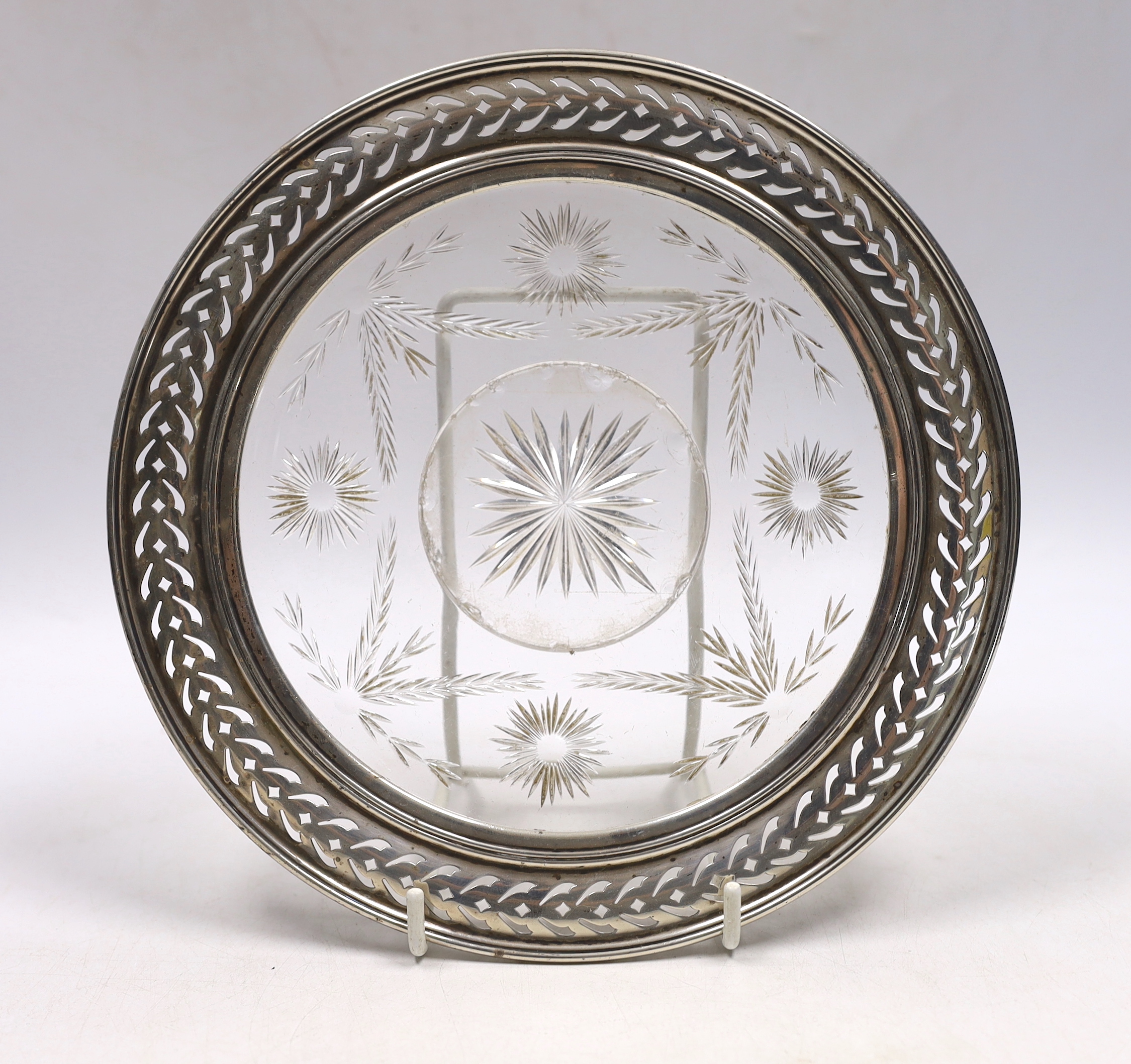 A late Victorian repousse silver cannister and cover, by William Comyns, London, 1896, 92mm a sterling mounted glass stand and a small silver cup.